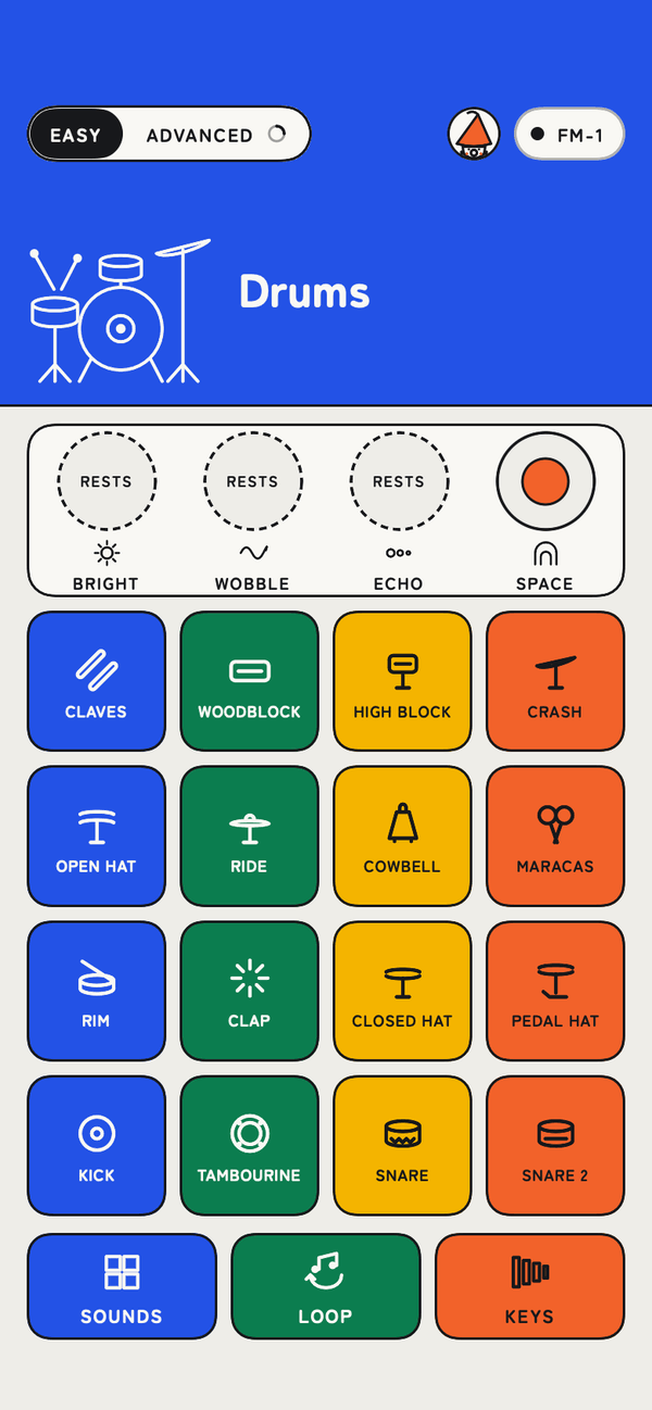 The app's Easy drums: sixteen coloured pads with drawings, Claves, Woodblock, High block, Crash and more.